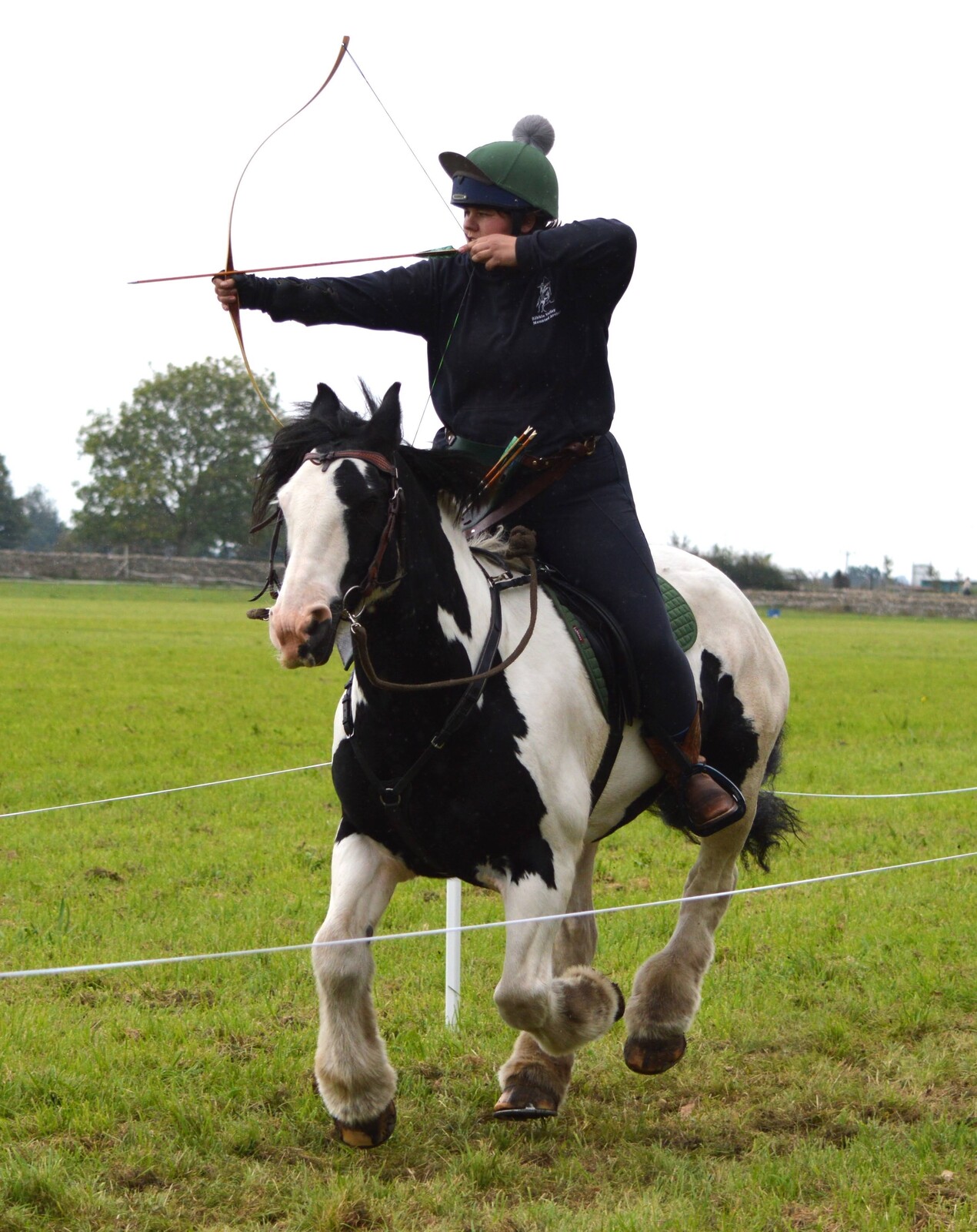 Lauren doing horse back archery